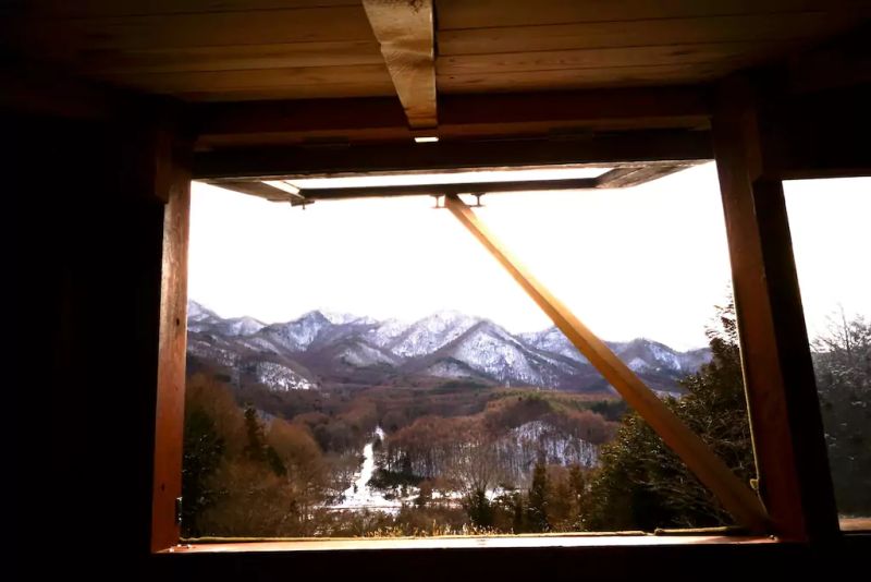Daigo designs tiny off-grid cabin in Japanese woods