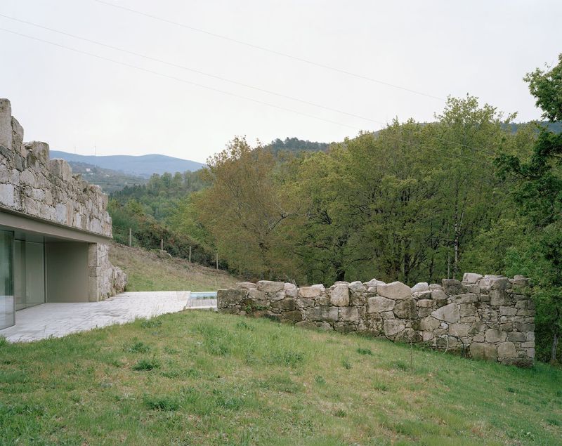Old stone house in ruins transformed into modern vacation home