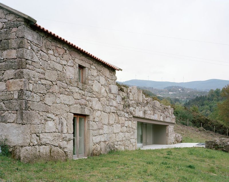 Old stone house in ruins transformed into modern vacation home