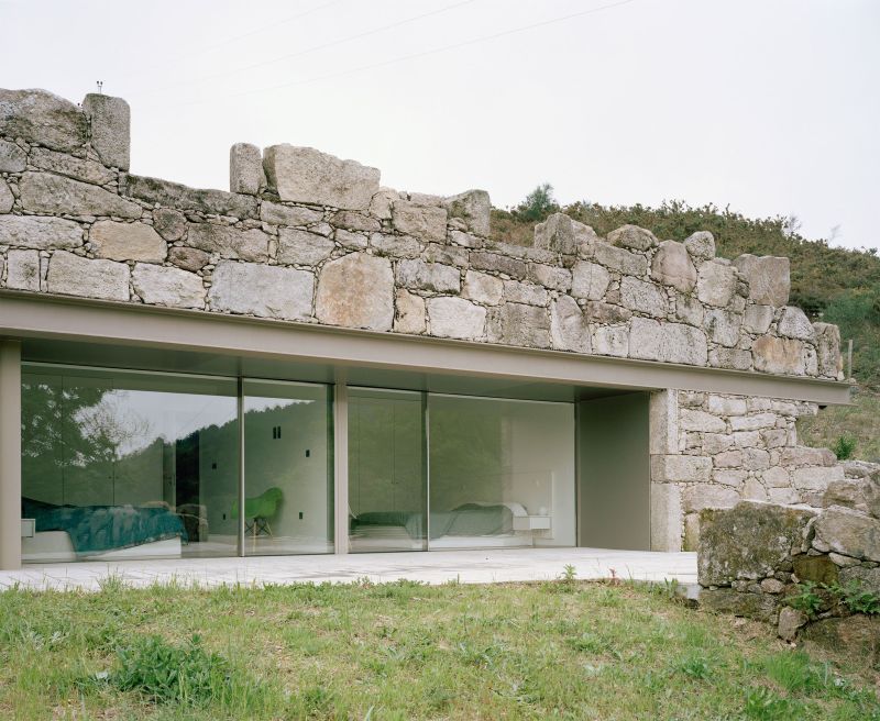 Old stone house in ruins transformed into modern vacation home