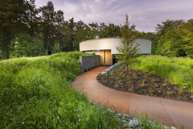 This circular house with big windows brings the outdoors in