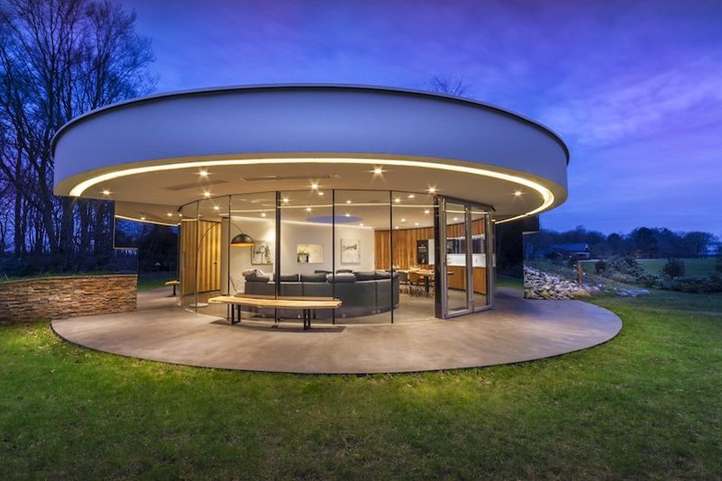 This circular house with big windows brings the outdoors in