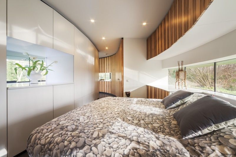 This circular house with big windows brings the outdoors in
