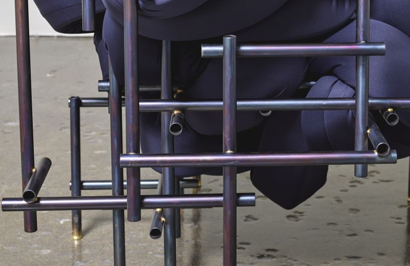 Lawless Chair by Evan Fay consists of foam ribbons interwoven in metal frame
