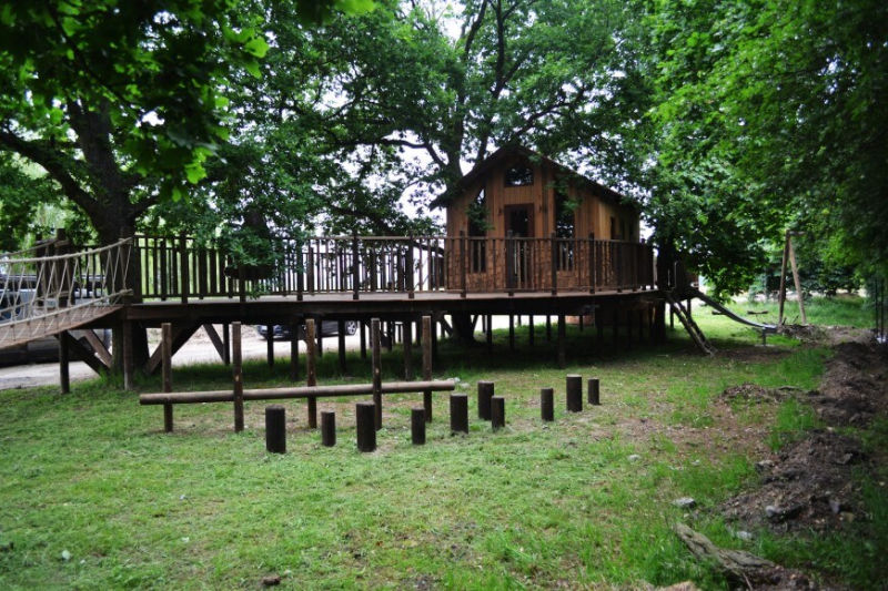 Nook treehouse in features sunken fire pit in the middle of amphitheatre seating