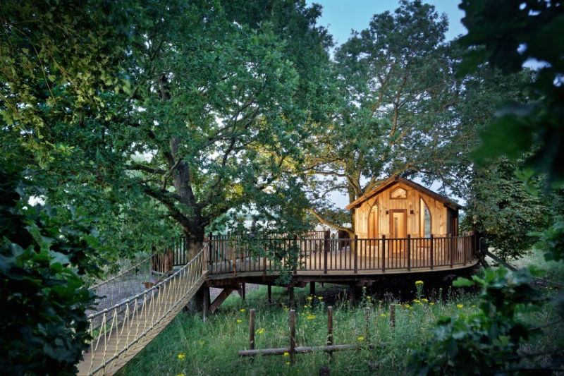 Nook treehouse in features sunken fire pit in the middle of amphitheatre seating