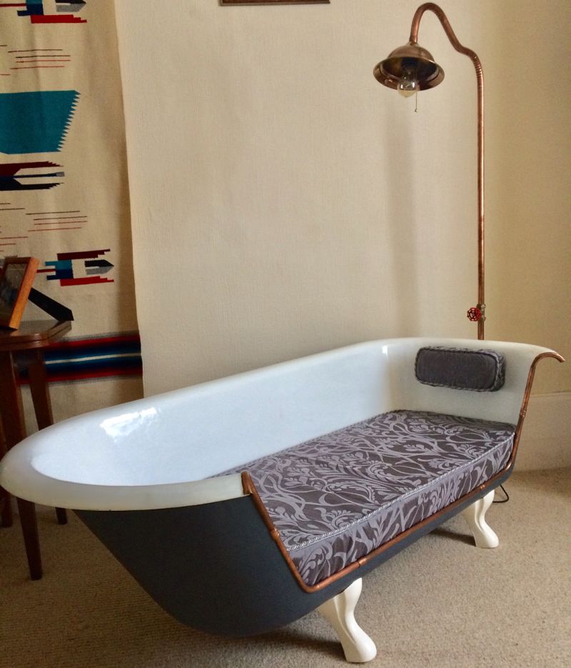Old bathtub into comfy sofa