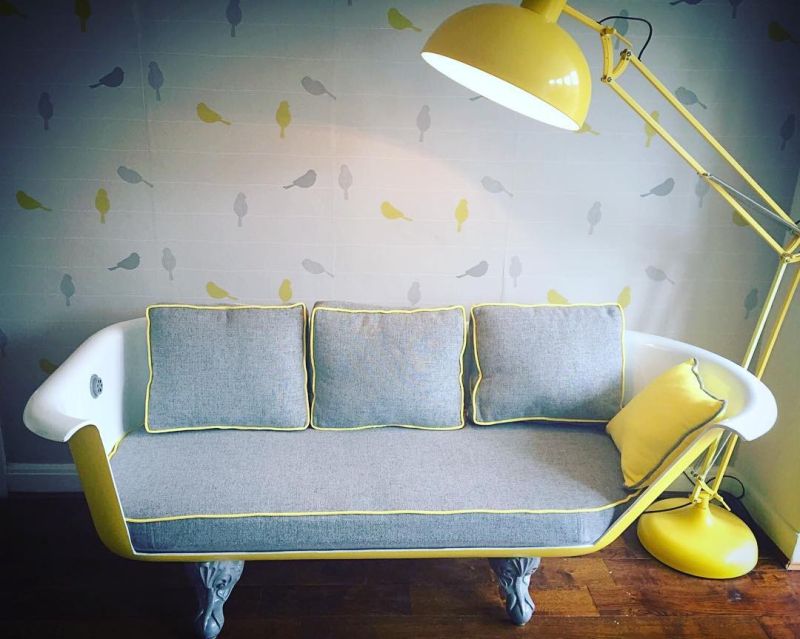 Old bathtub into comfy sofa