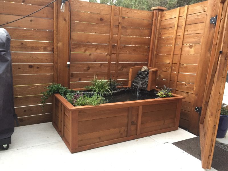 Old bathtub into garden pond