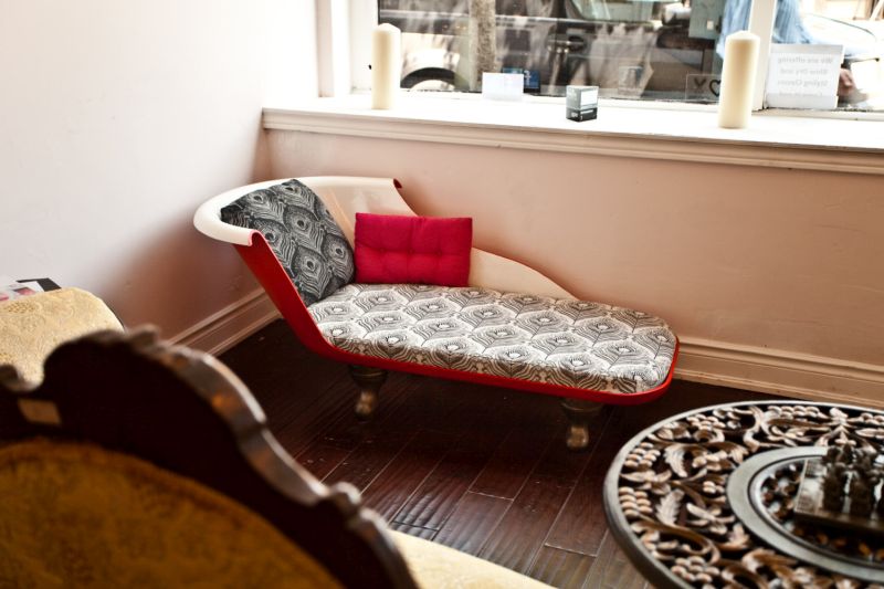 Old bathtub repurposed into sofa
