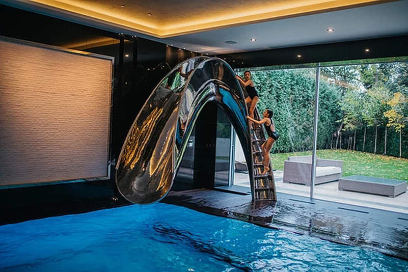 SplinterWorks’ sculptural pool slides bring unlimited fun to your home