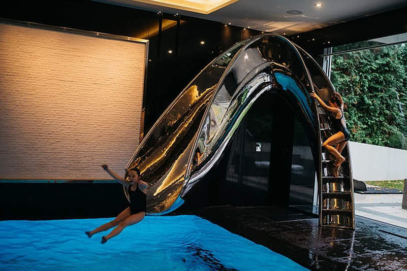 SplinterWorks’ sculptural pool slides bring unlimited fun to your home