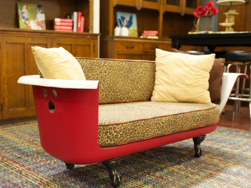 Old bathtub repurposed into sofa