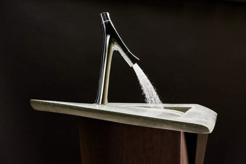 This concrete incline washbasin allows water to drain into the corner