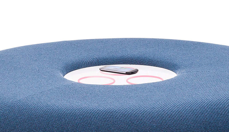Recharged public bench with central wireless charging station in HI-MACS