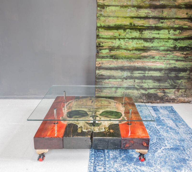 Beam coffee table with skull artwork on top