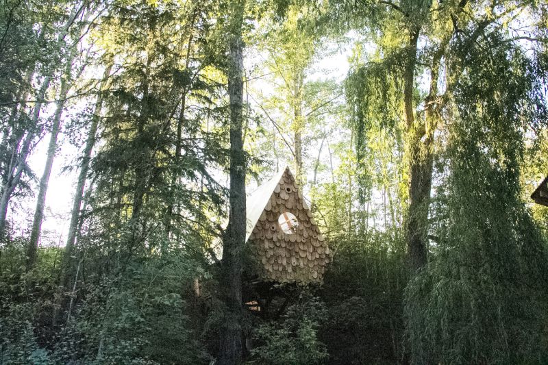 Studio North’s human-sized Birdhut features 20 birdhouses on its façade