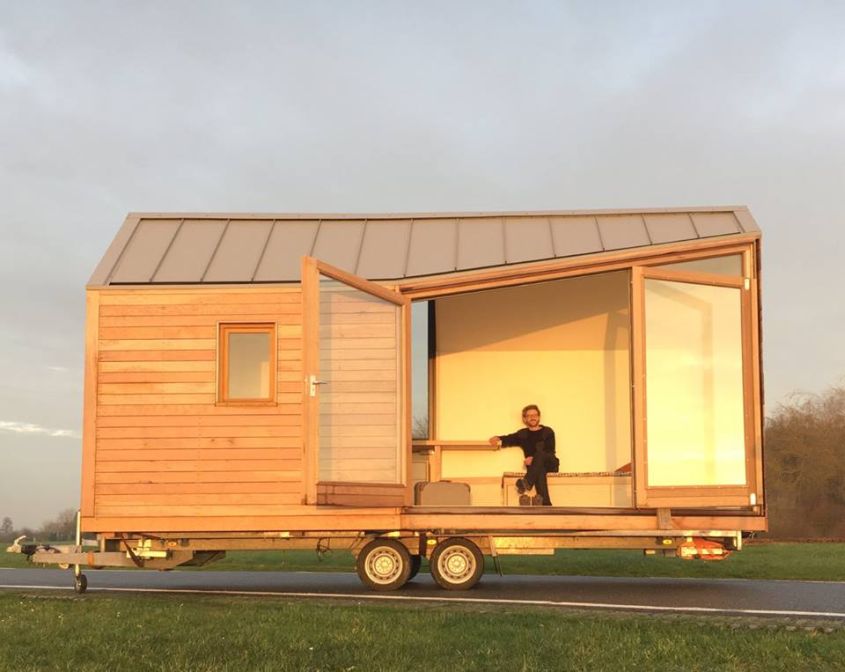 Porta Palace tiny house on wheels The minimalistic wooden building envelope combined with large fold-out glass doors adds unique aesthetics to this tiny house on wheels. Made by Dutch design studio WoonPioners, it is made from CLT boards that ensures thermal efficiency and sound insulation too. This tiny house comes complete with living area, kitchenette, bathroom, and a sleeping loft. 