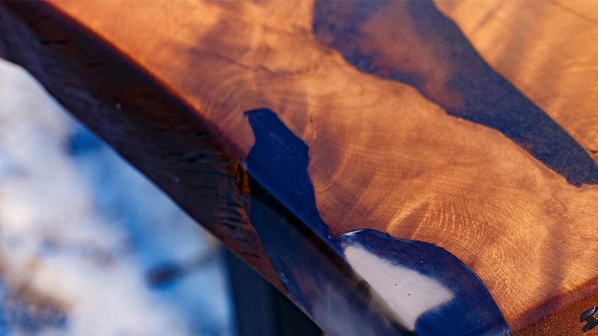 Hard Massive’s live edge dining table with epoxy resin inlay to look like river