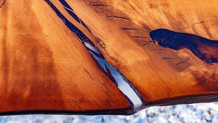Hard Massive’s live edge dining table with epoxy resin inlay to look like river