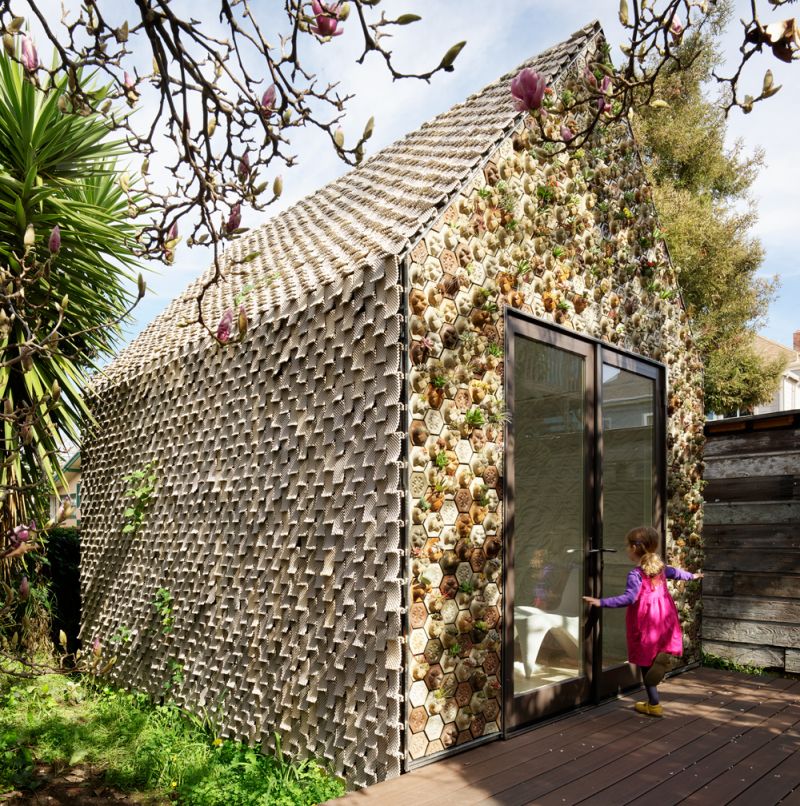 This 3D-Printed Cabin features a Living Wall of Succulents 