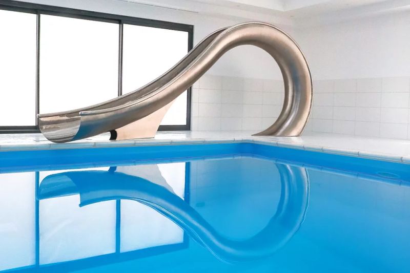 Waha Residential Water Slide from SplinterWorks Fits into Existing Pools 