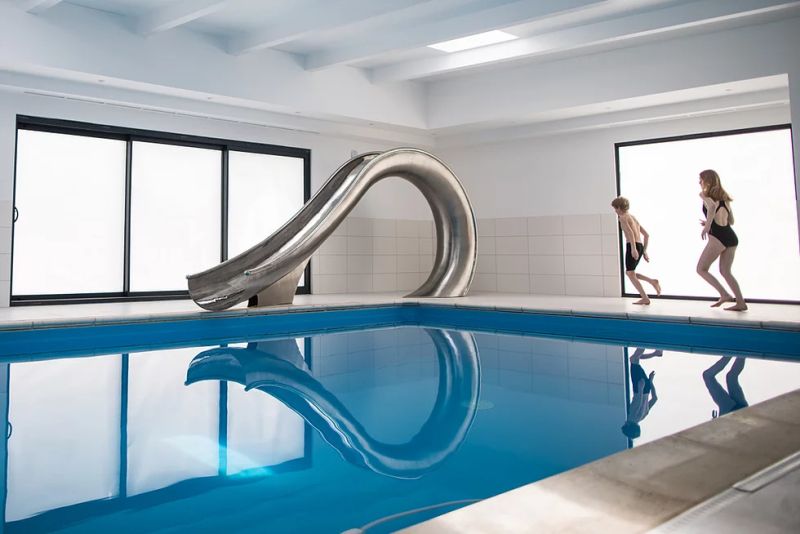 Waha Residential Water Slide from SplinterWorks Fits into Existing Pools 