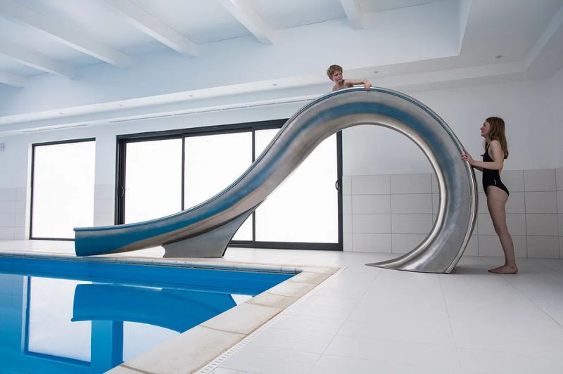 Waha Residential Water Slide from SplinterWorks Fits into Existing Pools 