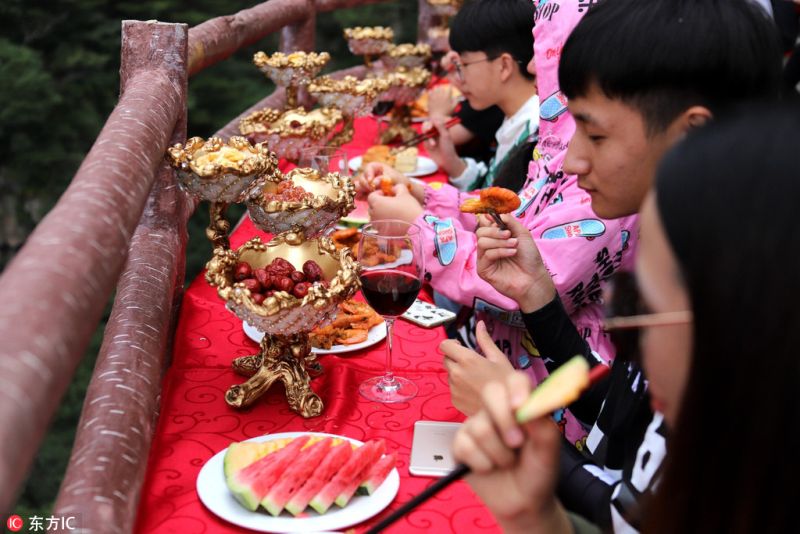 The feast in the sea of clouds on a Narrow Cliffside Pathway in China