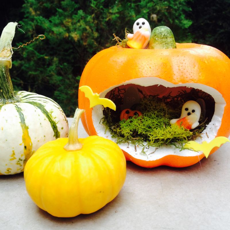 Halloween miniatures with a carved pumpkin house