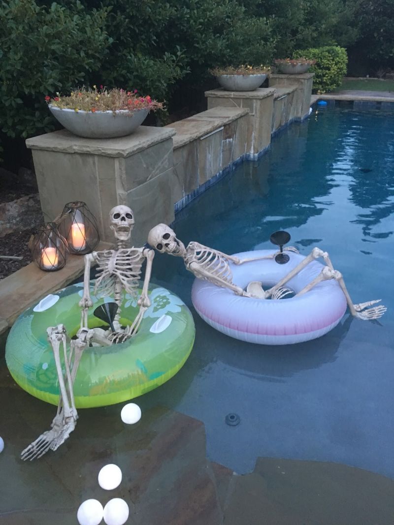 two skeletons in a pool for Halloween 