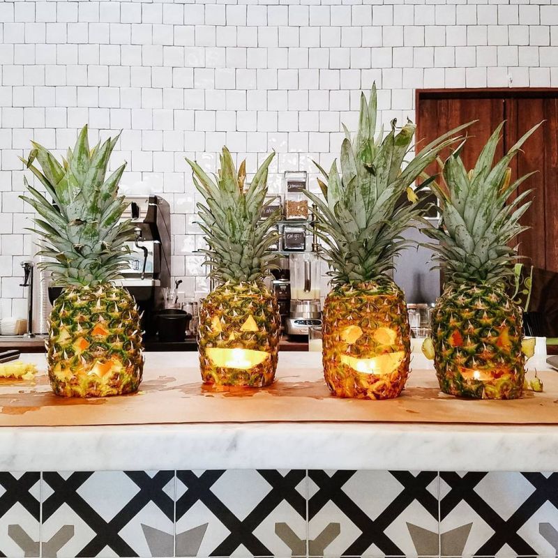 four Pineapple jack-o'-lanterns carving for halloween 
