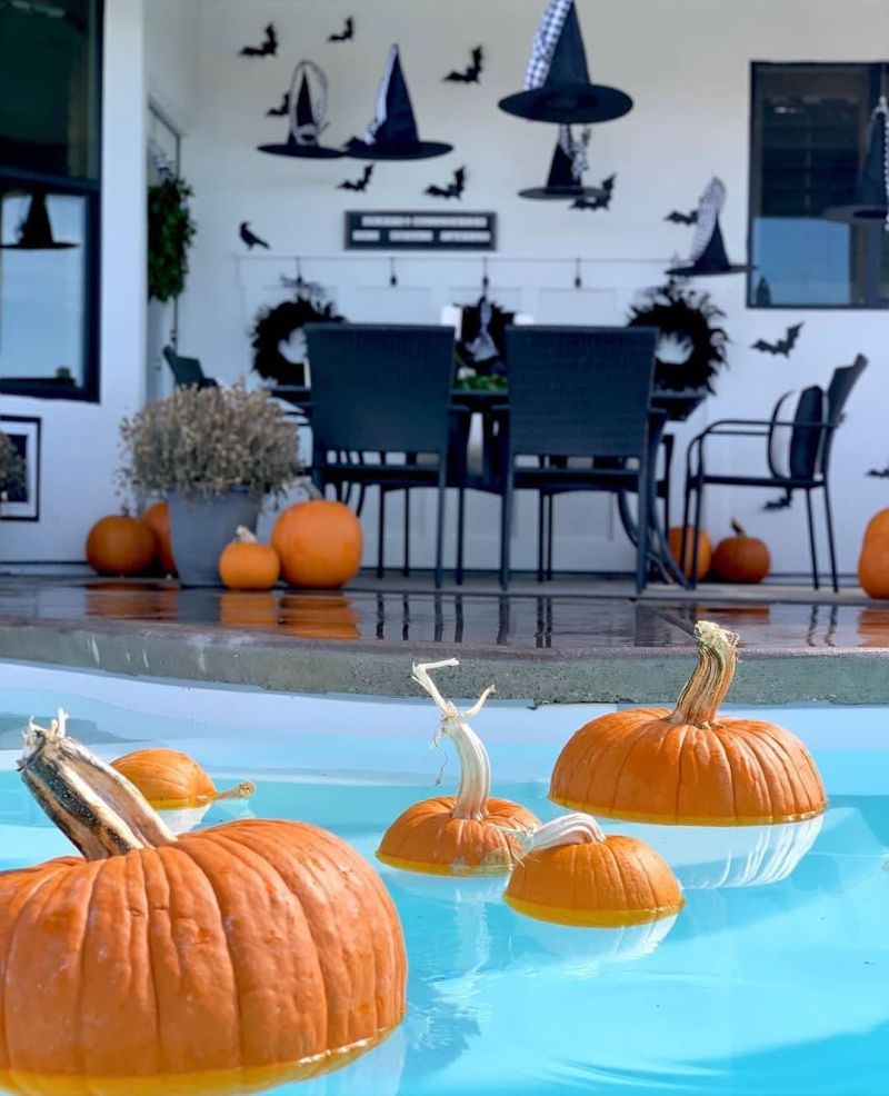 Pumpkins Floating in a pool for halowene  