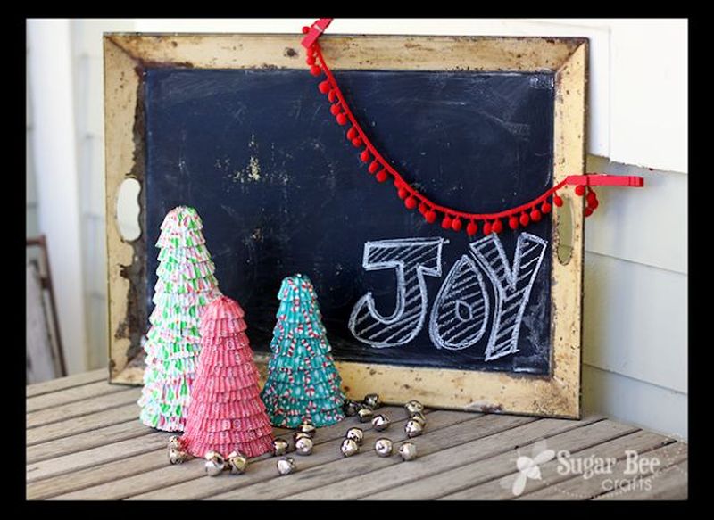 Cupcake Liner Christmas Trees A simple alternative Christmas tree centerpiece that can be prepared easily using cupcake wrappers. It is ideal to use different colors of cupcake liners. The base can also be prepared to give it a more elegant look. You can place them on a table or on a mount on a wall.