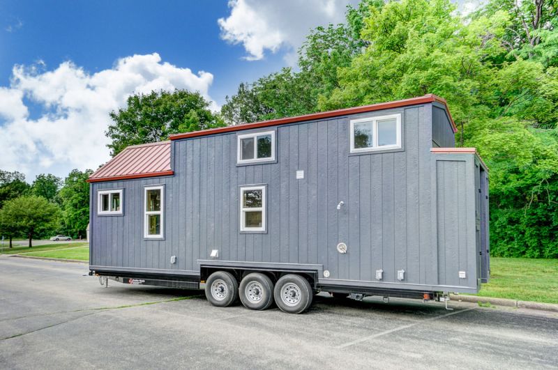 Modern Tiny Living’s Serenity Tiny House Features Office at Back Door