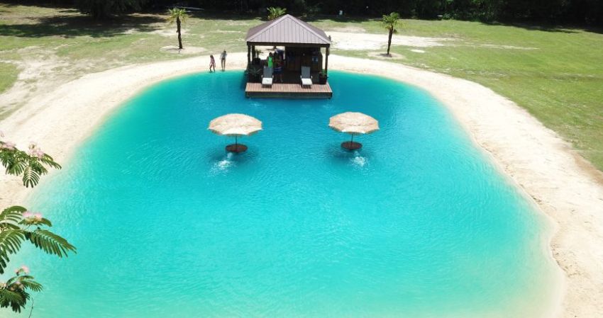 Zydeco Construction Builds Swimming Pond with Beach in ...
