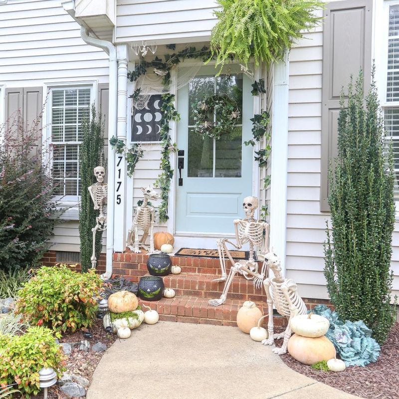 Skeleton couple sitting in the front porch