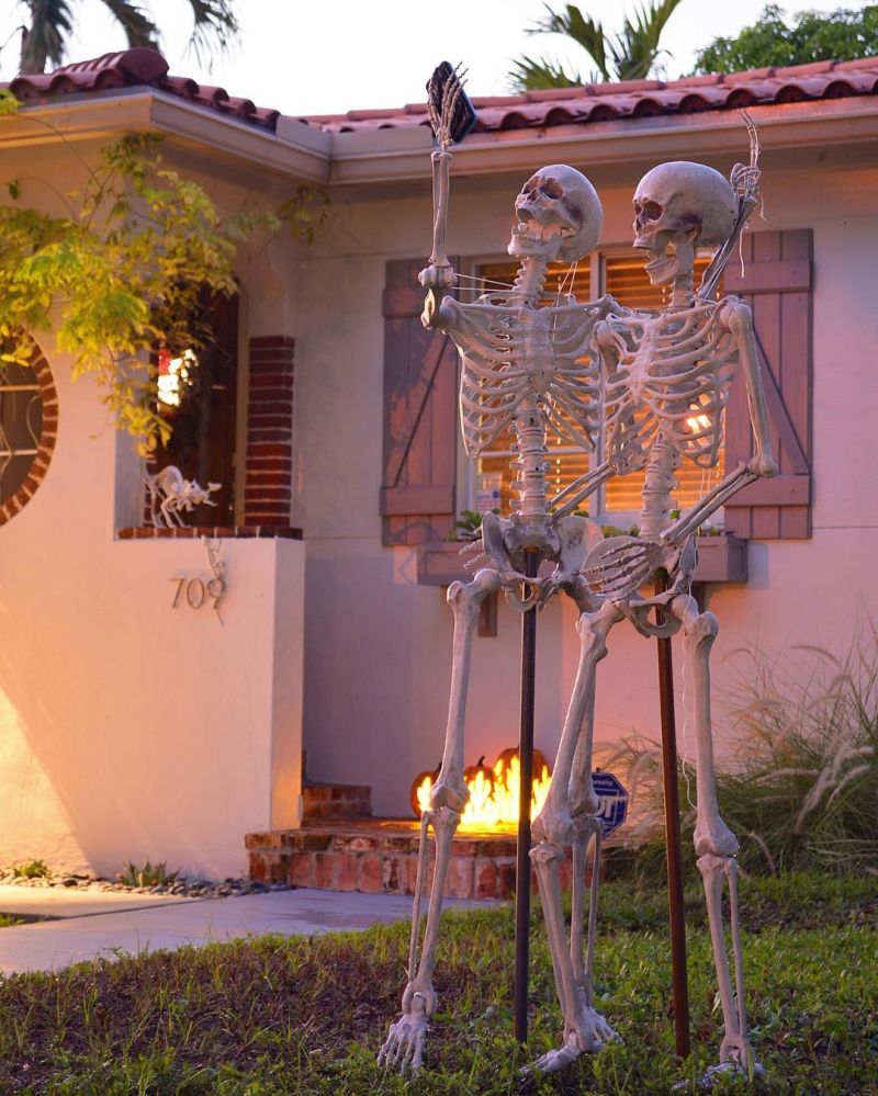 Skeleton couple taking a selfie