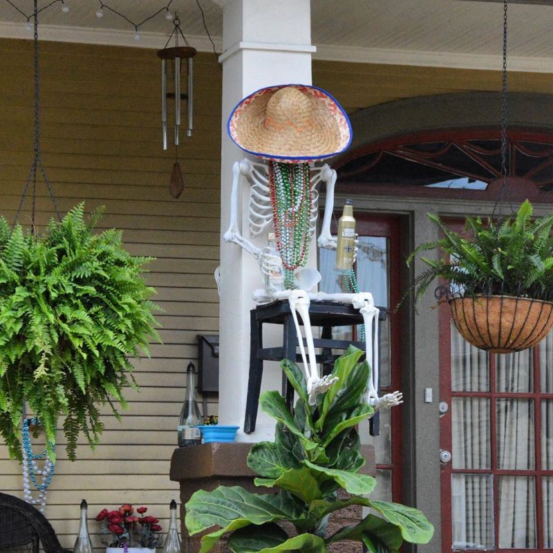 Skeleton drinker on a high chair