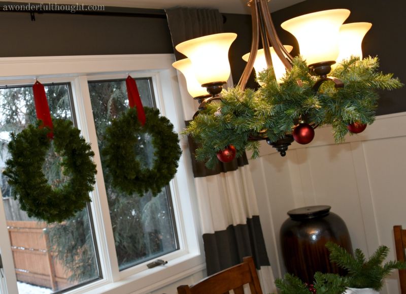 decorate chandelier with foliage and ornaments