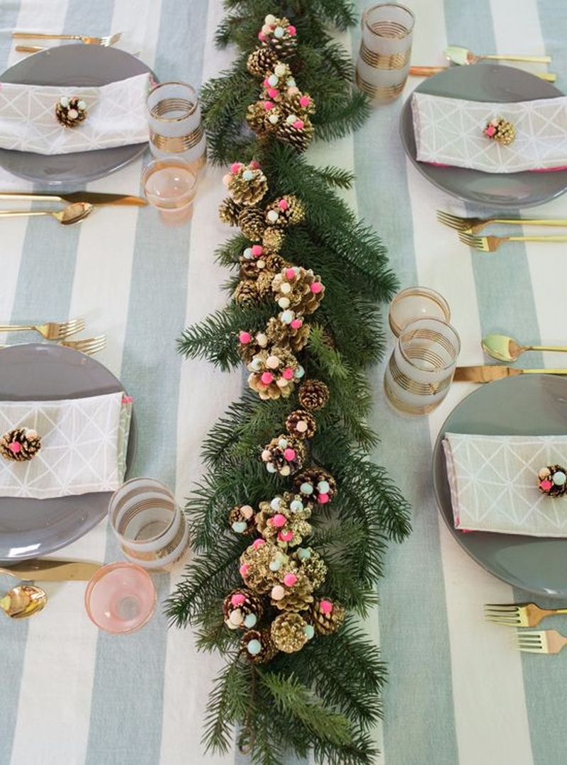 glittery pinecones and pom-poms on the Christmas dining table 