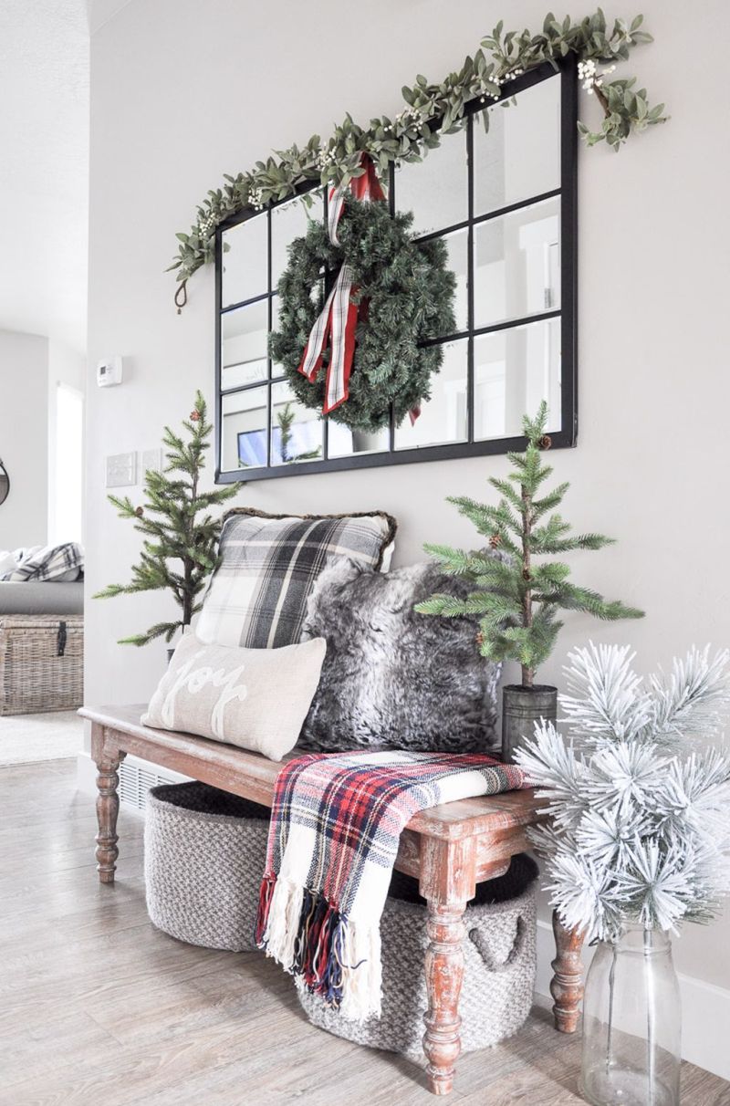 Christmas trees on a foyer table 