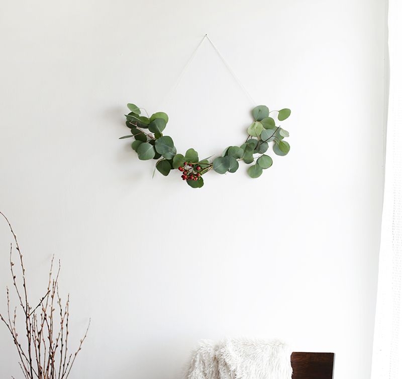 simple eucalyptus wreath on wall for Christmas 