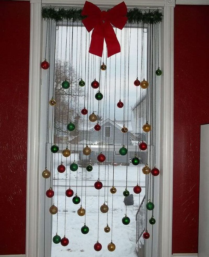 hanging ornaments and a ribbon bow on window 