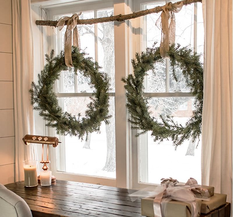 christmas wreaths hanging on window 