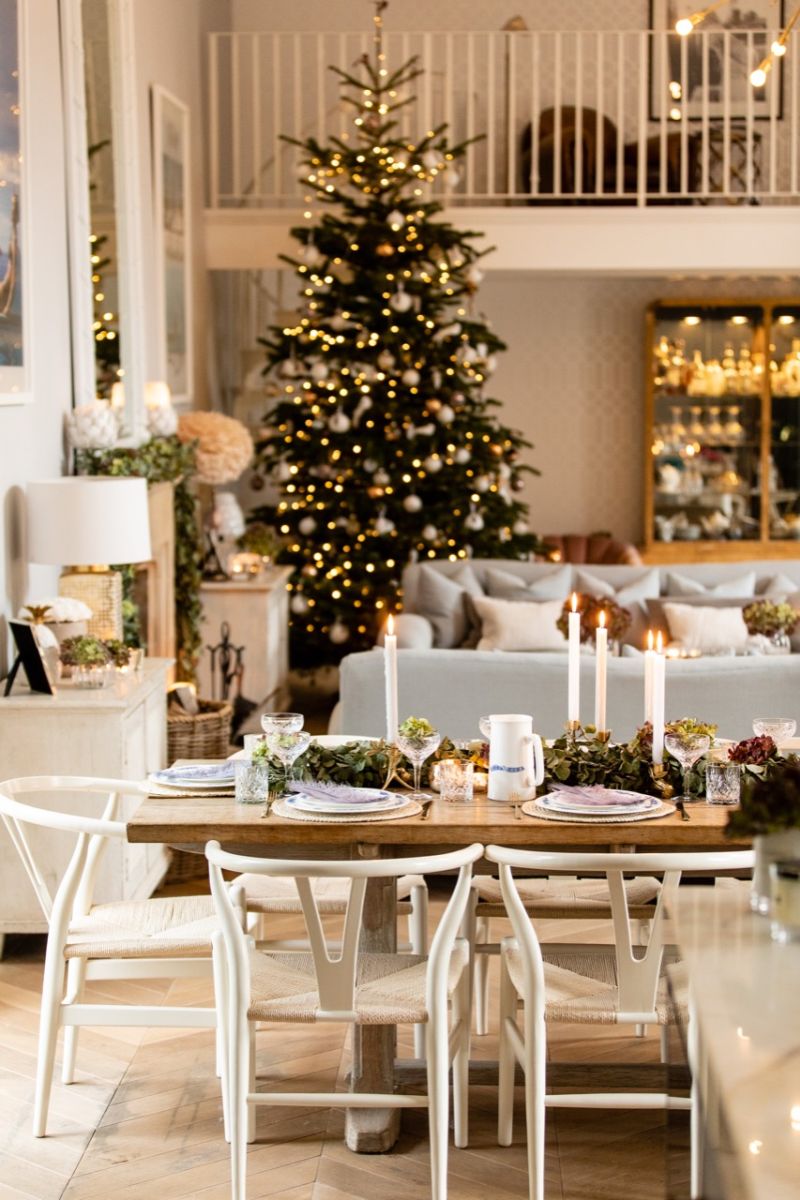 Christmas dining table can have eucalyptus garland and dried hydrangeas centerpiece