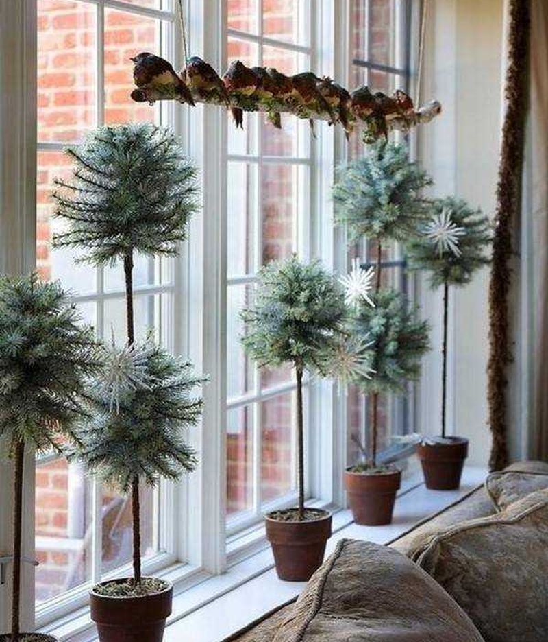 christmas planters on window sill 