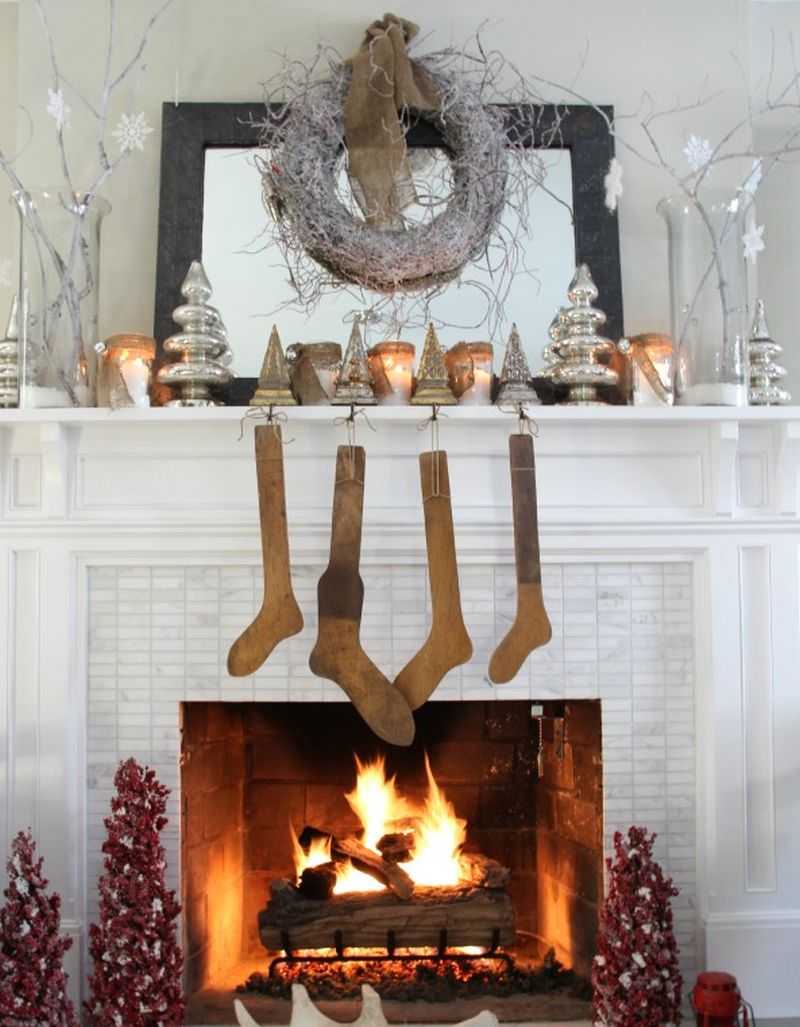 Fireplace Mantel Decor with branches, snowflakes, mercury glass, and candles