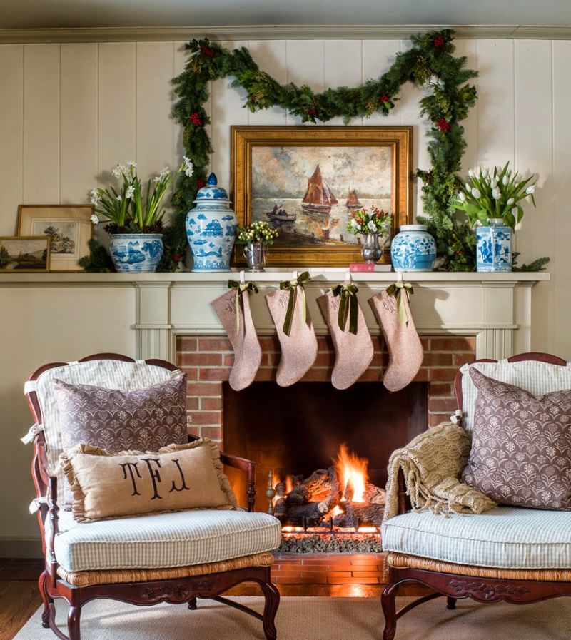 artwork over the fireplace mantel and vases 