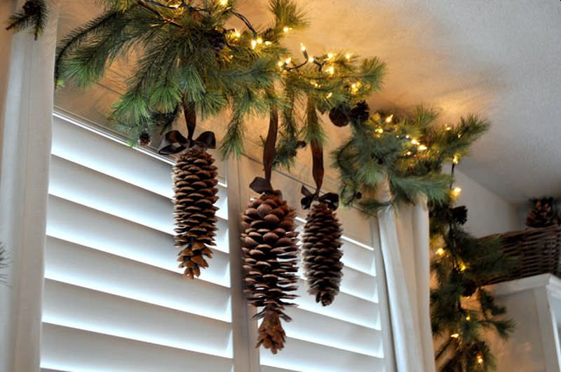 pine cones paired with twigs and lights